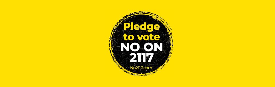 no on 2117 campaign logo, white text in black circle over gold background 